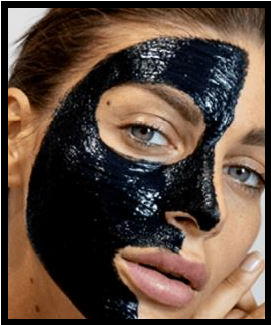 Woman having activated charcoal treament