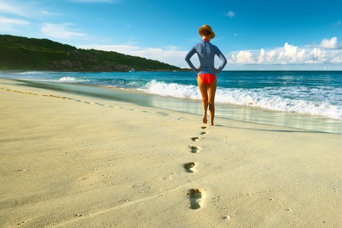 Woman in Rash Guard Protecting Skin From Sun Damage